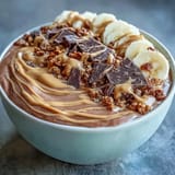 This thick and creamy Chocolate Peanut Butter Smoothie Bowl features a rich cocoa and peanut butter base.