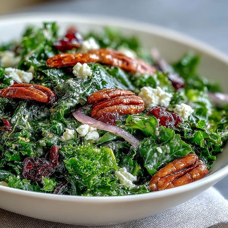 Hearty, easy warm kale salad with maple mustard dressing, ready for a delicious meal.