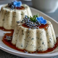 Creamy honey lavender panna cotta with delicate floral aroma and silky texture, served chilled in elegant glasses.